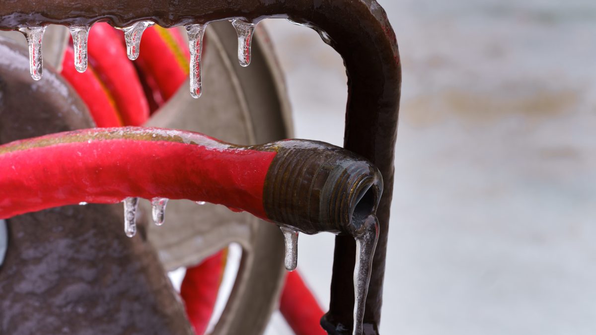 an ice encrusted garden hose is a common winter plumbing problem
